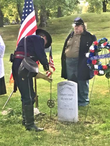 Placing Flag on Grave